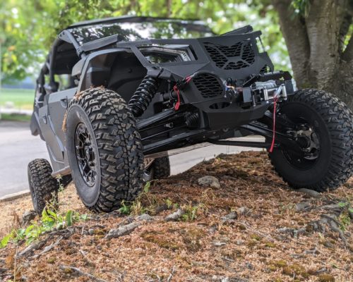 Black Strike-X4 with winch going up hill
